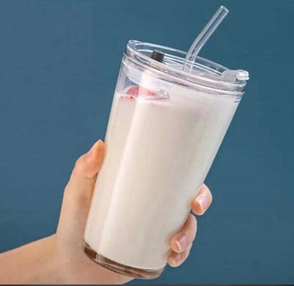 Plain glass cup with cover and glass straw