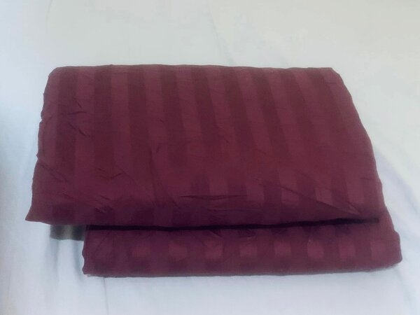 Burgundy bed linen, striped pattern, cotton.