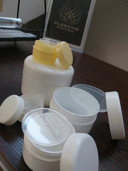 White jars with inner covers