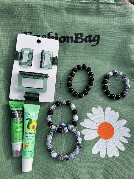 Hair clips, lip gloss and bracelets