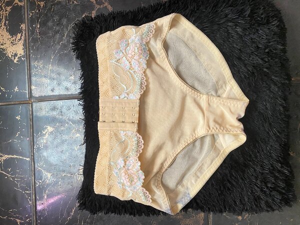 Pant with tummy adjustment pin