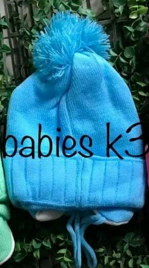Beanie with ties and 1 pompom blue