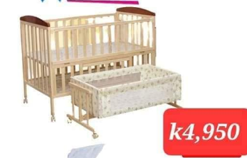 light brown wooden crib