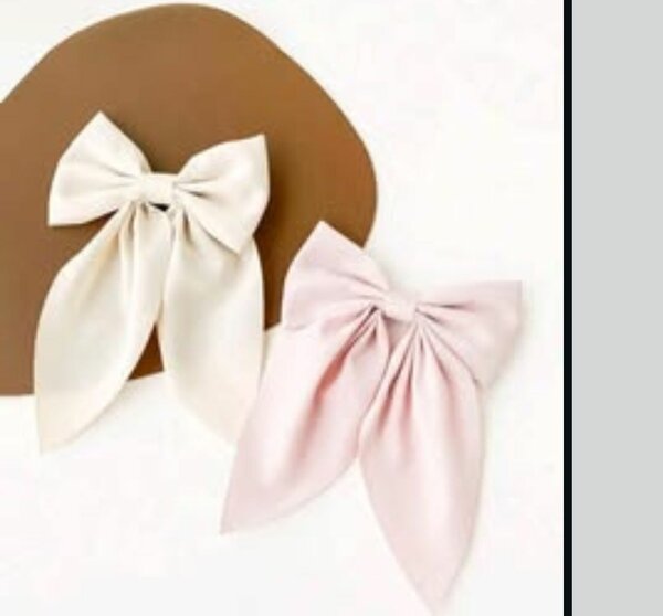 Big black bow and small pink and white bows
