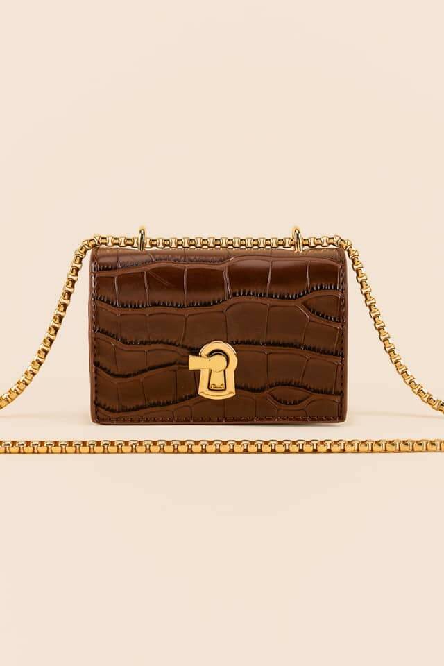 HAUTE SAUCE TEXTURED LOCK SLING BAG WITH CHAIN STRAP