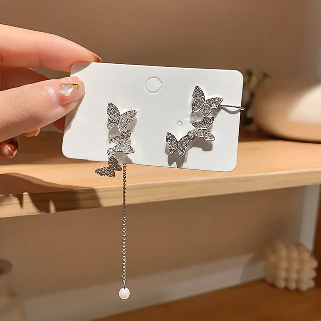 Boucle d'oreille en forme de papillon