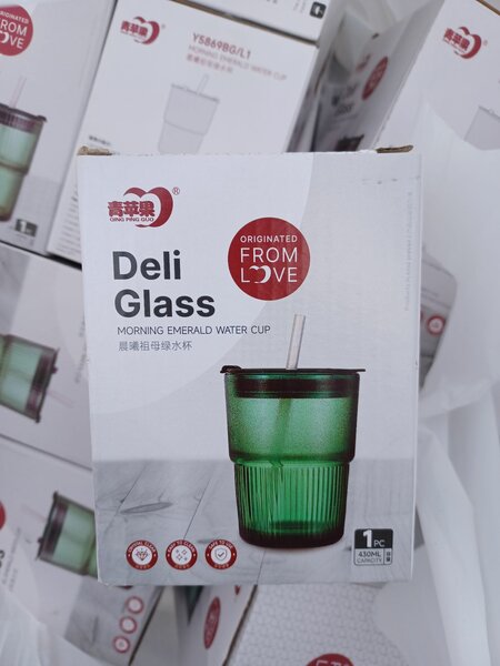 Glass cup with straw