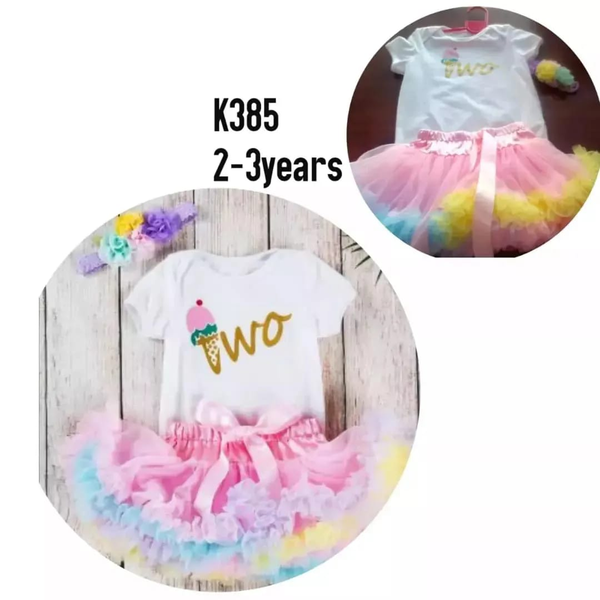 white printed T-shirt and pink lace skirt