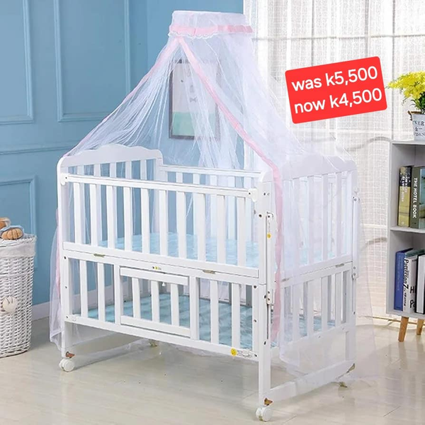 white wooden four-poster bed