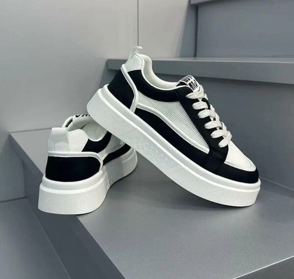 Chaussures montantes en cuir noir et blanc