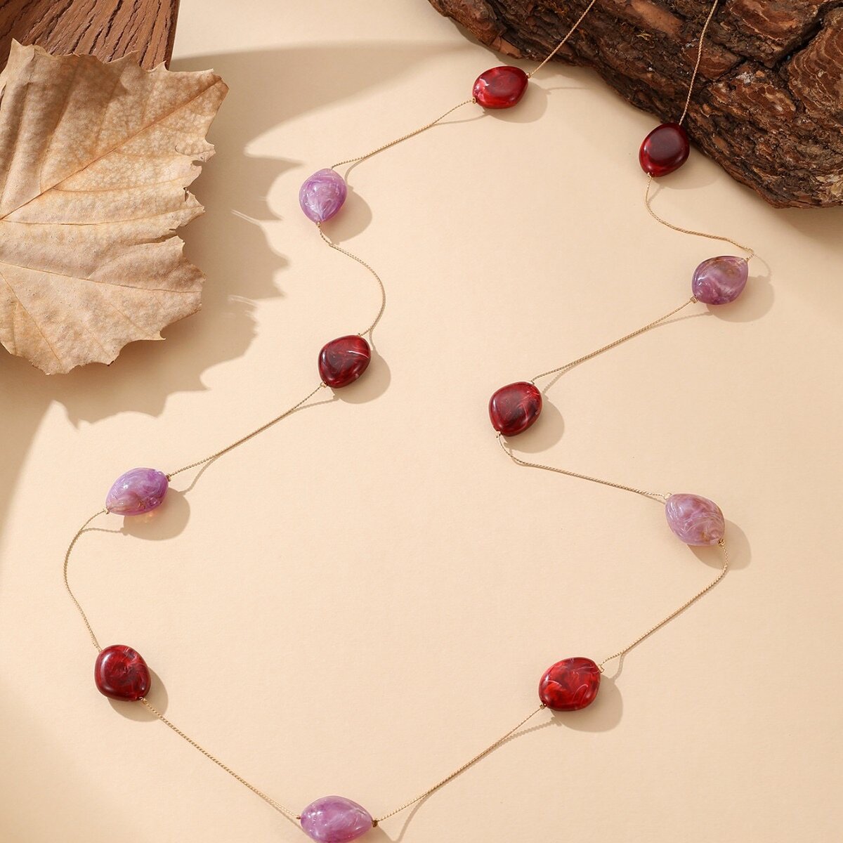 Collier pierres rouge et violet