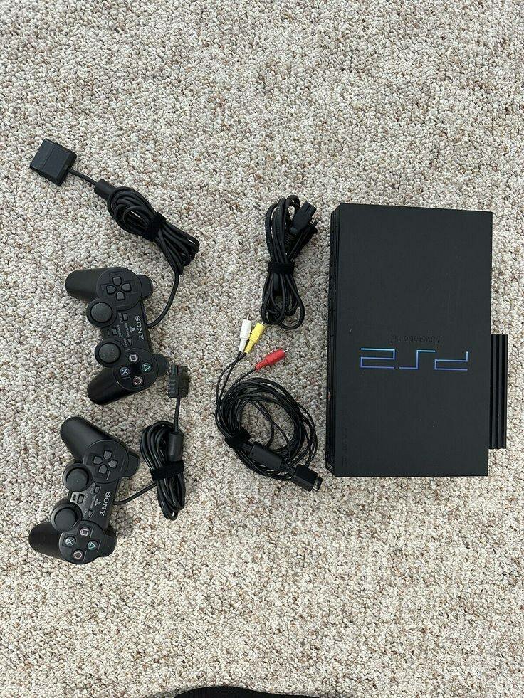 Console PlayStation 2 avec jeux et accessoires