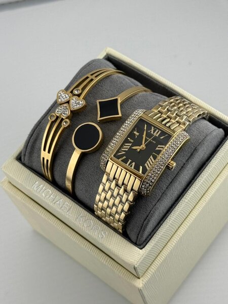 Montre Michael Kors en or avec bracelets