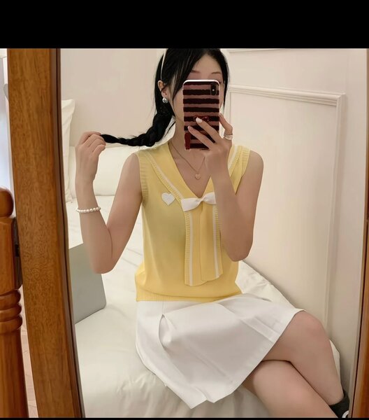 Blouse sans manches avec nœud