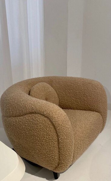 Fauteuil rotatif en tissu bouclé