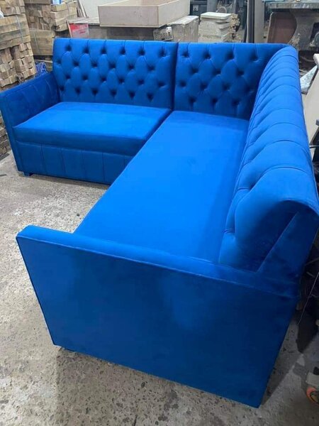 Canapé d'angle bleu capitonné