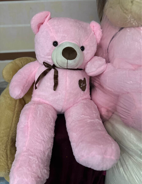 Gros ours en peluche rose et blanc