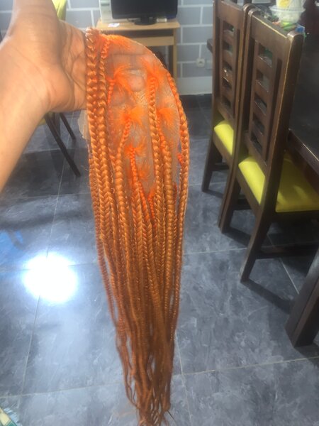 Tissage de cheveux tressé orange