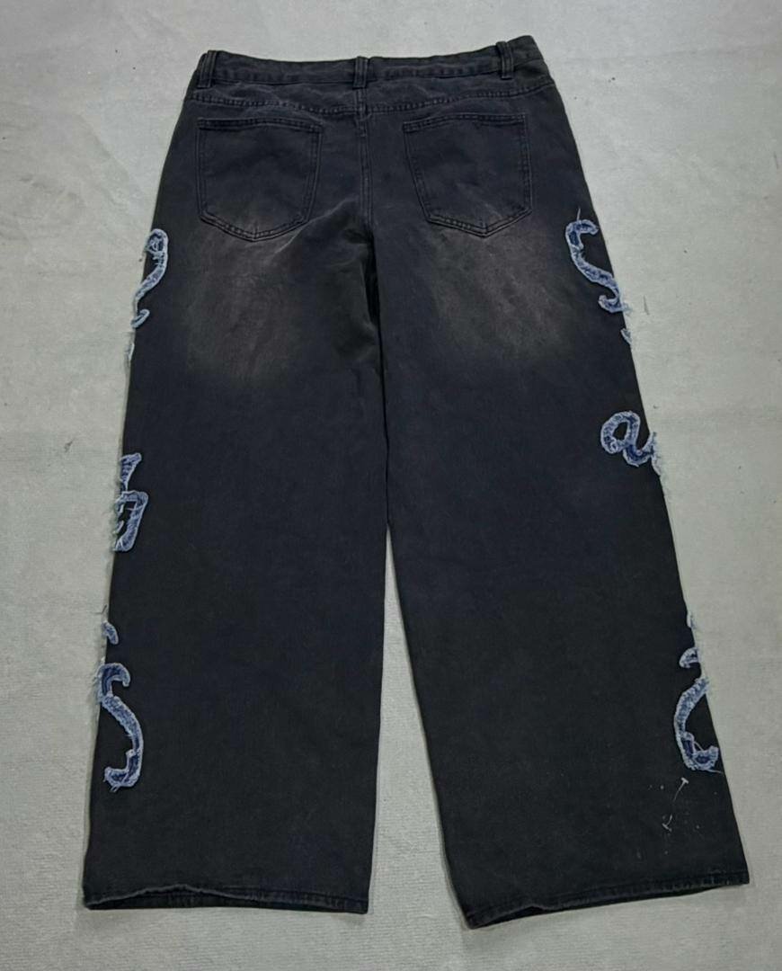 Jean noir large délavé avec lettrage