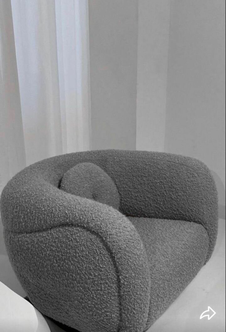 Fauteuil rotatif en tissu bouclé