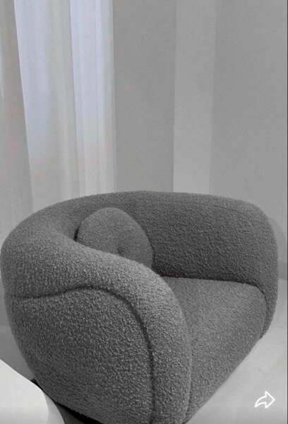 Fauteuil rotatif en tissu bouclé